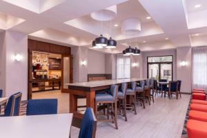 a dining room with a long table and chairs at Hampton Inn & Suites St. Louis-Chesterfield in Chesterfield