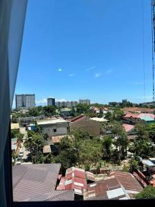 a view of a city with buildings and trees at Casa Mira Guadalupe by Leera's Condo in Cebu City +14 photos