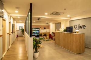 an office lobby with a reception desk at Olive Koramangala 4th Block by Embassy Group in Bangalore