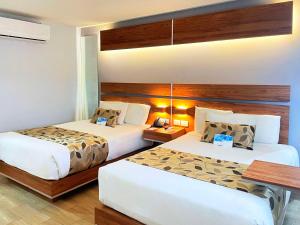 Una cama o camas en una habitación de Sleep Inn Mexicali