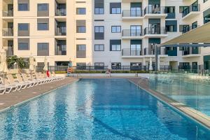 a large swimming pool in front of a building at Frank Porter - The Nook 2 in Dubai