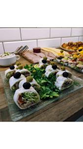 a bunch of food on a table withroups of food at Greg&Tom Hostel in Krakow