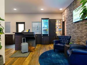 TV a/nebo společenská místnost v ubytování ibis Styles Kiel City