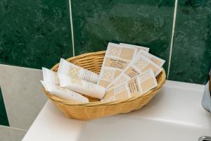 a basket filled with books sitting on a counter at Divina suite Cavaliere in Maiori +16 photos