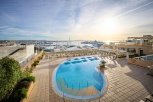 an overhead view of a large swimming pool on a building at Catalonia Majórica in Palma de Mallorca
