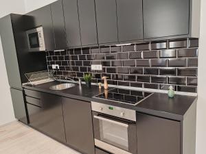 A kitchen or kitchenette at A5 Apartment - Budapest - hostAID