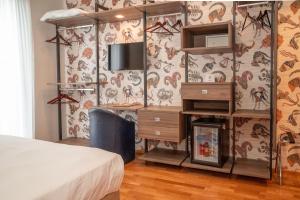 Postel nebo postele na pokoji v ubytování SIRIOHotel