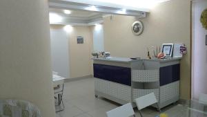 a room with a hair salon with a counter at Polet Hotel in Omsk