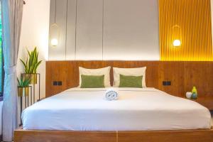 Postel nebo postele na pokoji v ubytování Uluwatu Yoga Resort