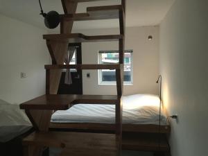 a bunk bed in a room with a ladder at I House Chinchin in Seoul