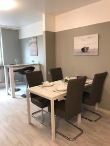 a dining room with a table and chairs at Hotel U - Aktienstraße 241 in Mülheim an der Ruhr in Mülheim an der Ruhr