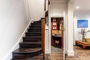 a staircase in a home with a stair case at Stunning 5 Bed House in Willesden Green! in London