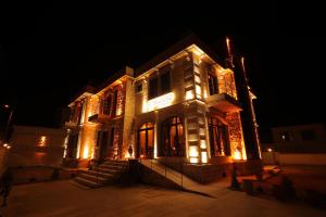 a building with lights on it at night at Milagro of Cappadocia in Uchisar