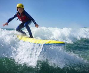 a person riding a wave on a surfboard in the ocean at m040, Geesala in Geesala