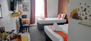 Postel nebo postele na pokoji v ubytování Nationwide Motel + 35 fotografií