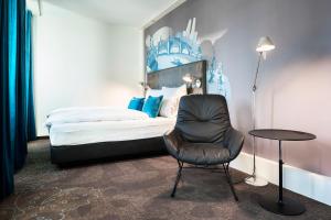 Llit o llits en una habitació de Motel One Basel