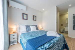 Ένα ή περισσότερα κρεβάτια σε δωμάτιο στο GuestReady - Gemini Apartment