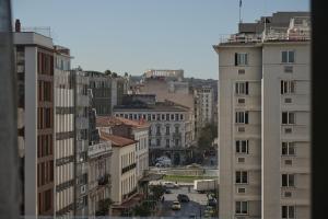 a view of a city with tall buildings at VISION OMONIA, ATHENS in Athens