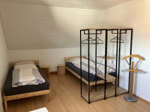 a bedroom with two bunk beds and a lamp at Festhaus Stocksberg - Herberge 1881 in Stocksberg