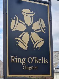 a sign for a ring o bells chipop at Ring O Bells in Chagford