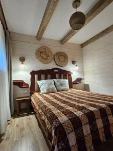 a bedroom with a large bed in a room at Садиба "333" in Yaremche +91 photos