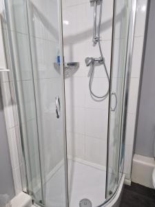 a shower with a glass door in a bathroom at Stunning 2-Bed Apartment in Coventry in Coventry