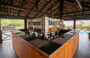 a bar with a lot of bottles of wine at Mankoview Beach Resort in Winneba
