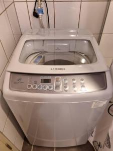 a washing machine in a corner of a room at Avatara B condominium B54 in Ban Tha Fat