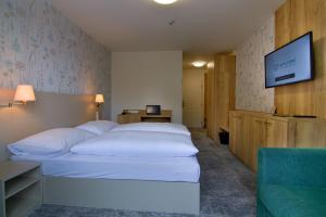 Кровать или кровати в номере Hotel Srní