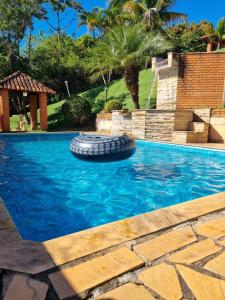 Bazén v ubytování Chácara Recanto do Morro nebo v jeho okolí