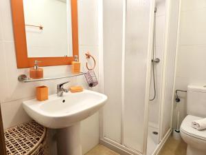 a white bathroom with a sink and a shower at Espliego Pool View Apartment in Torre-Pacheco +22 photos