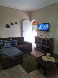 TV a/nebo společenská místnost v ubytování Chácara Recanto do Morro + 20 fotografií