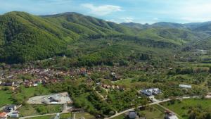 an aerial view of a village in the mountains at Glamping Cisnadioara in Cisnădioara