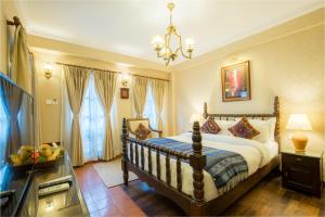 Voodi või voodid majutusasutuse Baber Mahal Vilas - The Heritage Hotel toas