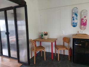 a kitchen with a table and two chairs and a table at SOHL FARM in Neutrebbin