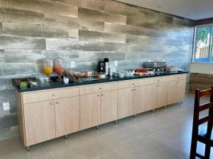 a kitchen with a counter with food on it at Hotel Brisas in Bom Jesus da Lapa