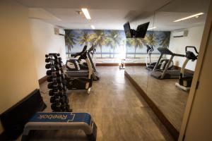 a gym with treadmills and exercise bikes in a room at Mirador Rio Copacabana Hotel in Rio de Janeiro