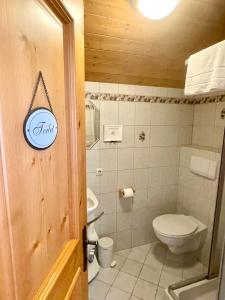 a bathroom with a toilet and a sink at Villa Edyta Ellmau in Ellmau