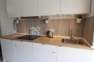 a kitchen with a sink and a counter top at Apartment Blanco - Vina Mar III in La Mata