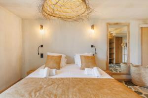 Giường trong phòng chung tại Le Domaine de la mer - Beachhotel Nature&Authenticite Hyères