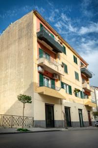 a building with balconies on the side of it at Sikelìa in Nicosia