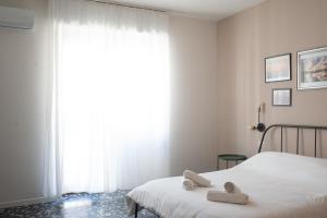 Letto o letti in una camera di Four Rooms Alghero