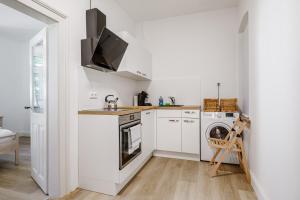 Kuchyň nebo kuchyňský kout v ubytování Old Town Center Apartments
