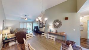 a dining room and living room with a table and chairs at Escape to Magnolia Run 2 Bedroom Golf Villa in Pawleys Island