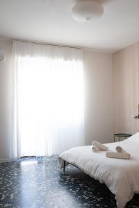 Letto o letti in una camera di Four Rooms Alghero