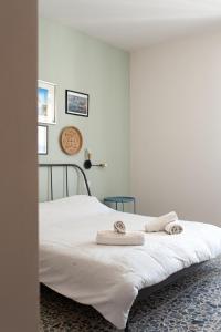 Letto o letti in una camera di Four Rooms Alghero