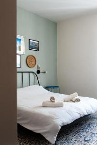 Letto o letti in una camera di Four Rooms Alghero