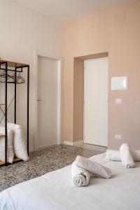 Letto o letti in una camera di Four Rooms Alghero