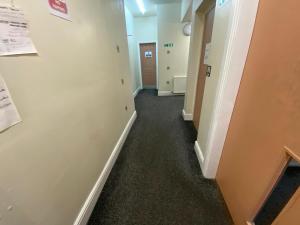 a hallway of an office building with a hallway at Sea Side Hotel in Skegness