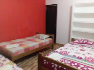 Ein Bett oder Betten in einem Zimmer der Unterkunft Villa del Carmen e hijos